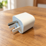 Aisiting U.S. Type B grounding safety adapter on a table, plug view